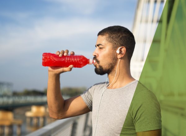 An athlete drinking juice for energy and training.